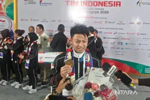 Lifter Rahmat Erwin Persembahkan Emas Asian Games untuk Keluarga